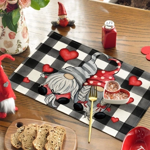 Close-up of linen placemat with buffalo check gnome pattern and heart decor