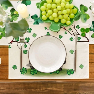 St. Patrick's Day shamrock linen placemat on wooden table with elegant table setting