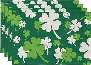 Close-up of four-piece green linen table mats with St. Patrick's Day clover patterns