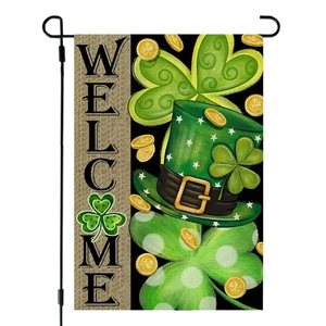 St. Patrick's Day garden flag with shamrocks and gold coins on a black metal stand