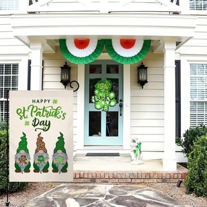 Outdoor setup of linen garden flag with St. Patrick's Day gnomes and lucky clover sign