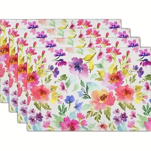 Lot de 4 sets de table aux motifs floraux aquarellés vibrants sur fond blanc épuré