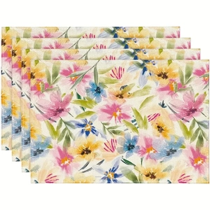 Gros plan de quatre sets de table texture lin avec des motifs floraux peints à la main