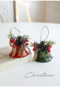 Christmas iron bells with pine cones, red berries, and rustic twine bows for festive decor