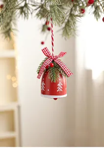 Close-up of a festive red Christmas bell with snowflake patterns and gingham bow decoration