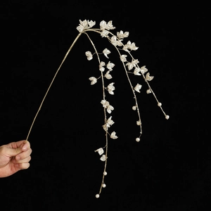 White silk floral hairpiece with gold wire and dangling pearls for wedding decoration
