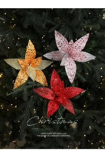 Close-up of sparkling sequined Poinsettia flowers for festive Christmas tree decoration
