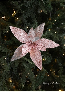 Close-up of pink glitter fabric poinsettia with sequins for Christmas tree decoration
