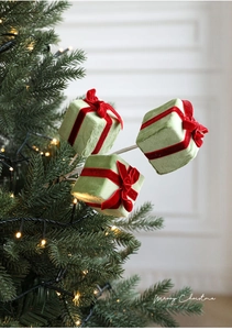 Three light green flocked Christmas gift box branches with red velvet bows for tree decor