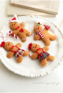 Close-up of four gingerbread man fabric pendants with scarves and candy canes
