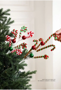 Close-up of red and white twisted plush candy cane pick with shiny festive ornaments