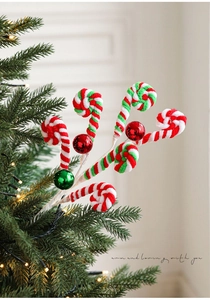 Macro view of plush red, white and green spiral candy cane picks for Christmas tree decor