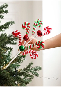 Detail of plush Christmas peppermint lollipop picks for festive holiday tree decoration