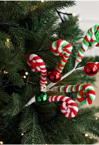 Detail of plush candy cane picks with colorful baubles for Christmas tree decoration
