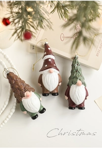 Three-piece set of festive gnome ornaments with pine cone and Christmas tree hats