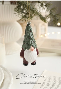 Detail of Nordic gnome ornament with Christmas tree hat and golden hanging string