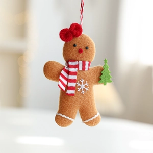 Brown gingerbread man felt ornament with red bow and striped scarf for Christmas tree