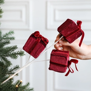 Christmas foam gift box ornaments featuring deep red velvet bows on decorative branches
