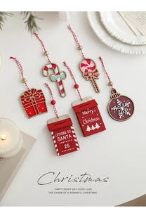 Flat lay of colorful Christmas wooden ornaments with candy canes and gift box designs