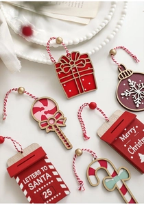 Close-up of red and white wooden Christmas ornaments on vintage festive background