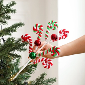 Christmas tree pick featuring plush candy cane swirls and metallic red and green ornaments