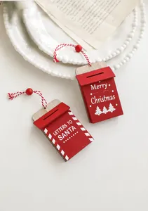 Detail of red wooden Merry Christmas letter charms with cotton strings on artistic plates