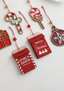 Detailed view of red wooden Christmas ornaments with candy canes and Santa letters