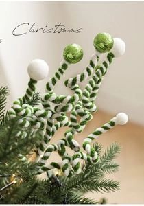 Close-up of green and white glitter candy cane sticks for Christmas tree decoration