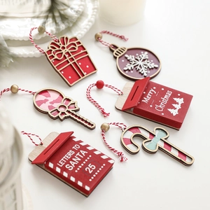 Set of festive red and white wooden Christmas tree ornaments with Santa letterbox and candy