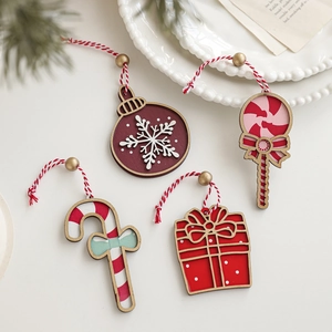 Set of 4 red and white wooden Christmas tree ornaments featuring classic festive shapes