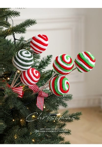 Detailed view of red and green spiral Christmas candy tree picks with plaid bows