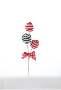 Detail of Christmas candy lollipop pick with spiral red green yarn balls and bow tie