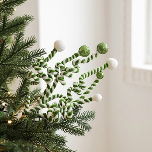 Christmas tree decoration featuring green and white spiral glitter ball picks in festive scene