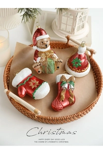 Detailed close-up of festive Christmas themed ornaments in a cozy holiday basket setting