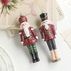 Glittery plastic nutcracker soldier ornaments with gold cords for Christmas tree decor