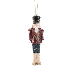 Classic nutcracker soldier ornament with red uniform and gold accents for Christmas trees