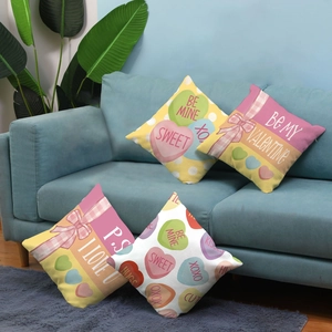 Detail of four colorful Valentine's Day plush pillowcases with heart and bow patterns