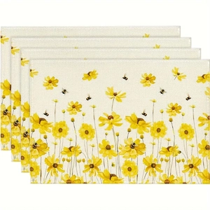 Détail d'un lot de quatre sets de table en lin avec marguerites jaunes et abeilles
