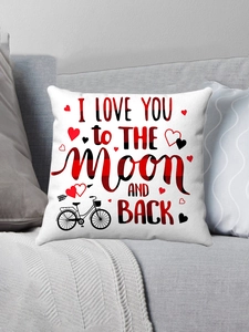 Close-up of Valentine pillow cover with heart prints on a gray fabric sofa
