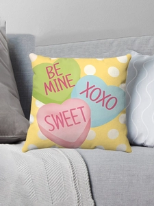 Close-up of pink Valentine plush pillowcase with heart candy patterns and sweet messages