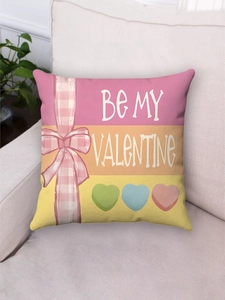 Detail of pink Valentine throw pillow with Be My Valentine text and heart patterns