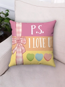 Detailed view of pink bow and I Love U text on a plush striped heart pillowcase