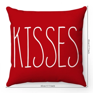Detailed view of red plush pillow case with white Kisses text and 45cm size marking
