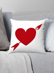 Detail of white plush pillowcase featuring a red heart and arrow Valentine's Day design