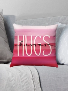 Detail of pink gradient cushion cover with white HUGS and black kisses script lettering
