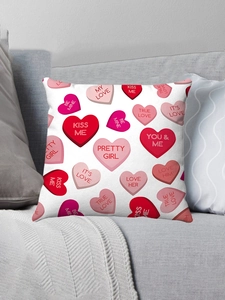 Detail of pink hearts cushion cover with romantic text on a cozy grey home sofa