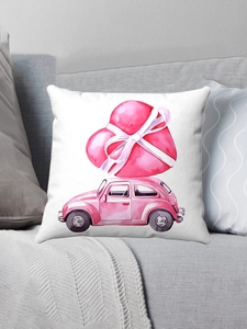 Detail of white square pillow featuring pink vintage car and red heart on grey sofa