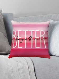 Detail of pink gradient pillow case with Better Together print on a gray sofa