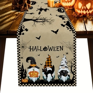 Halloween table runner with gnomes and black checkered border on a rustic wooden table