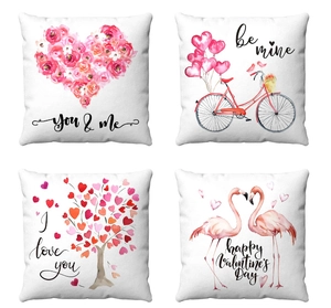 Set of four white Valentine's Day throw pillow covers with flamingo and heart patterns